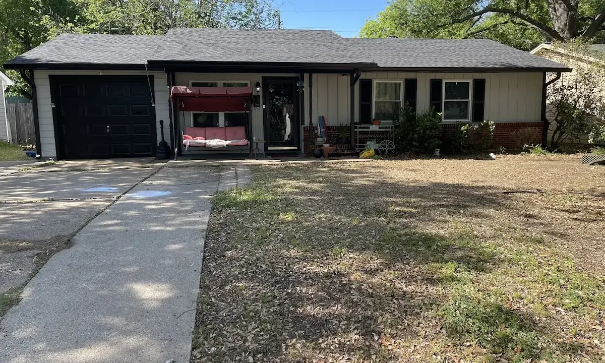 Asphalt Shingle Roof Repair crew at work on a residential roof in Manvel